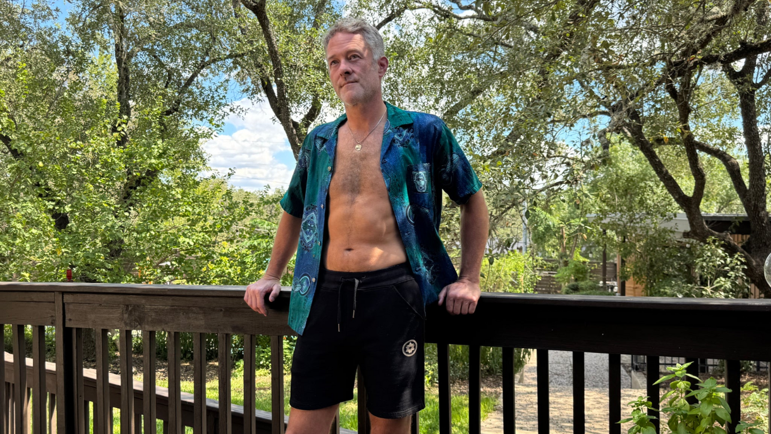 man outside under tress in sweatshorts by Datsusara